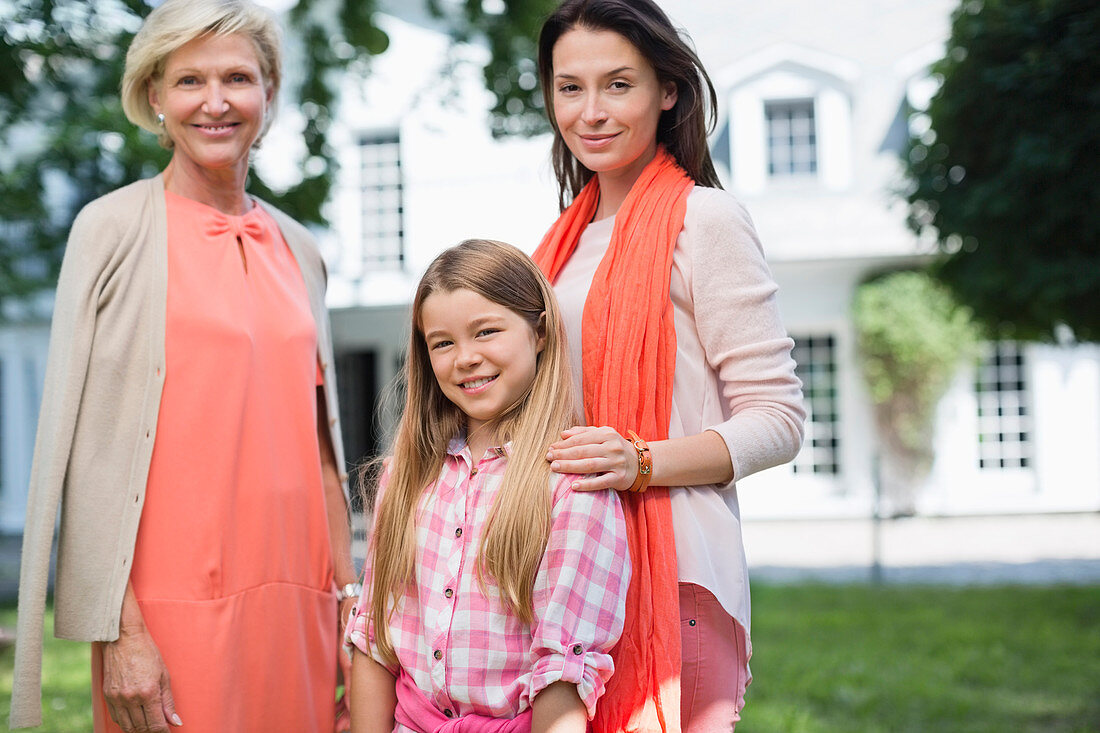 Three generations of women smiling