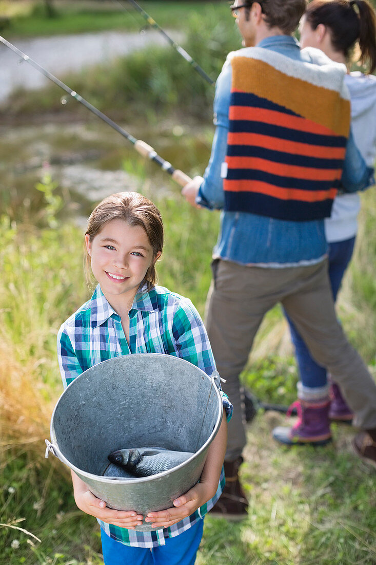 Girl showing off fishing catch