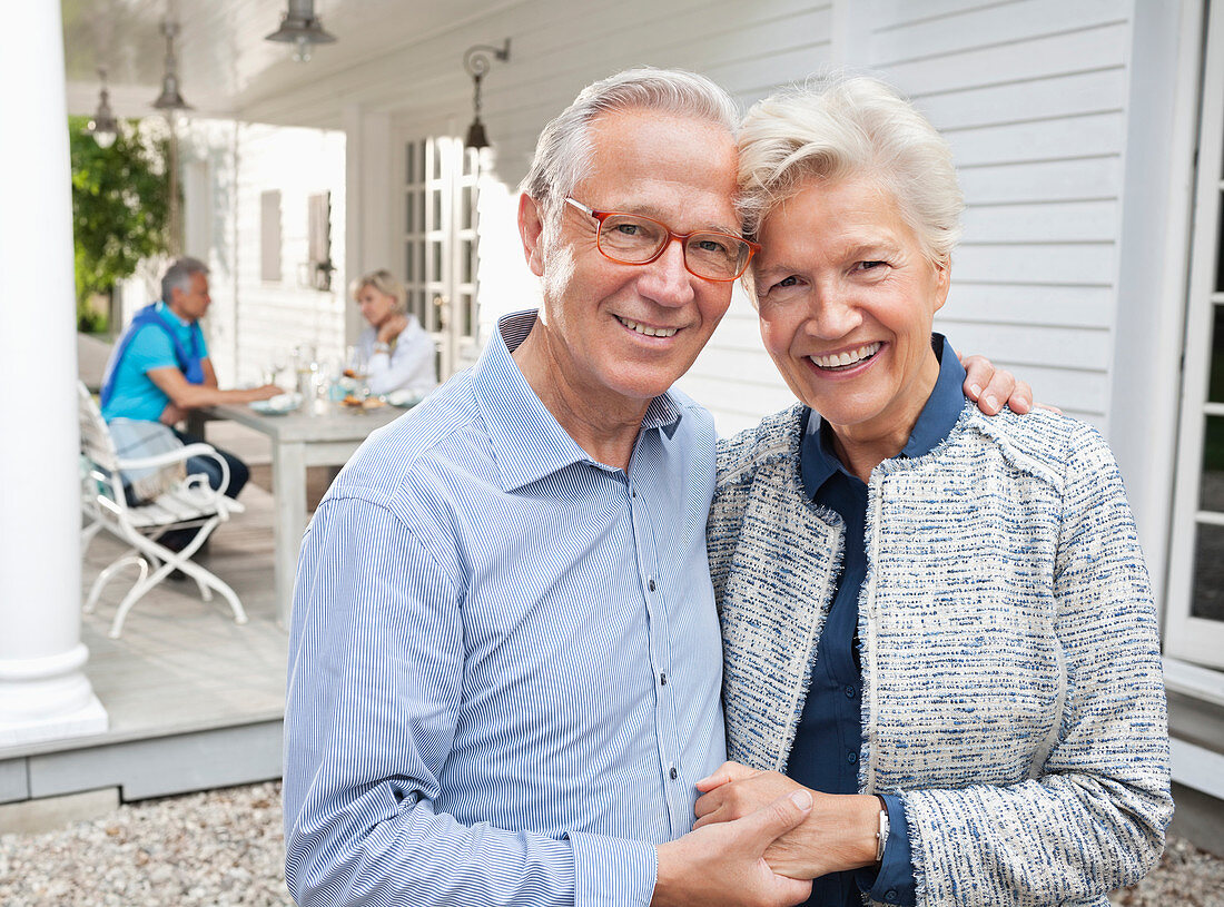 Smiling couple hugging outdoors