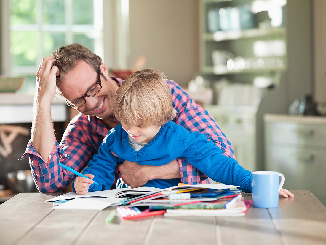 Father and son doing homework