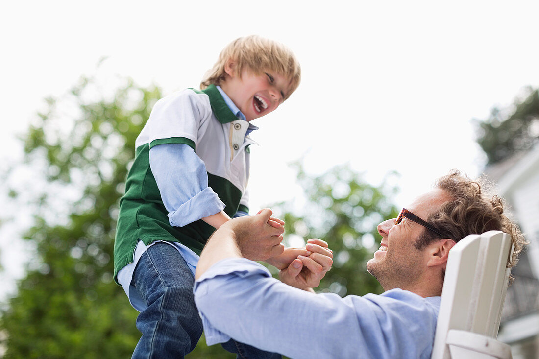 Father and son playing outdoors