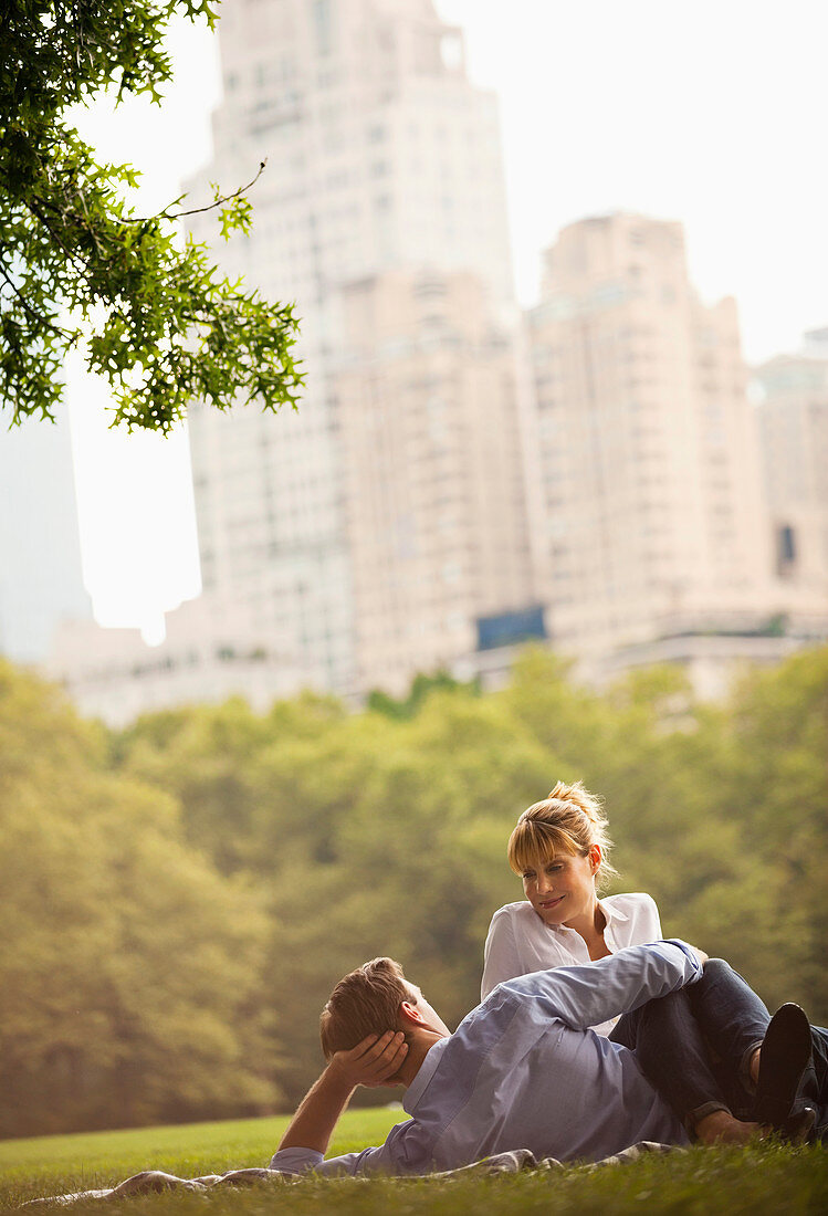 Couple relaxing in urban park