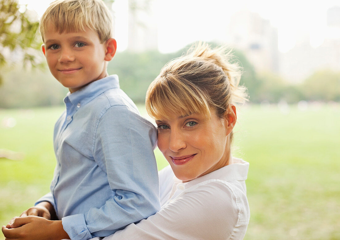 Mother and son relaxing in urban park