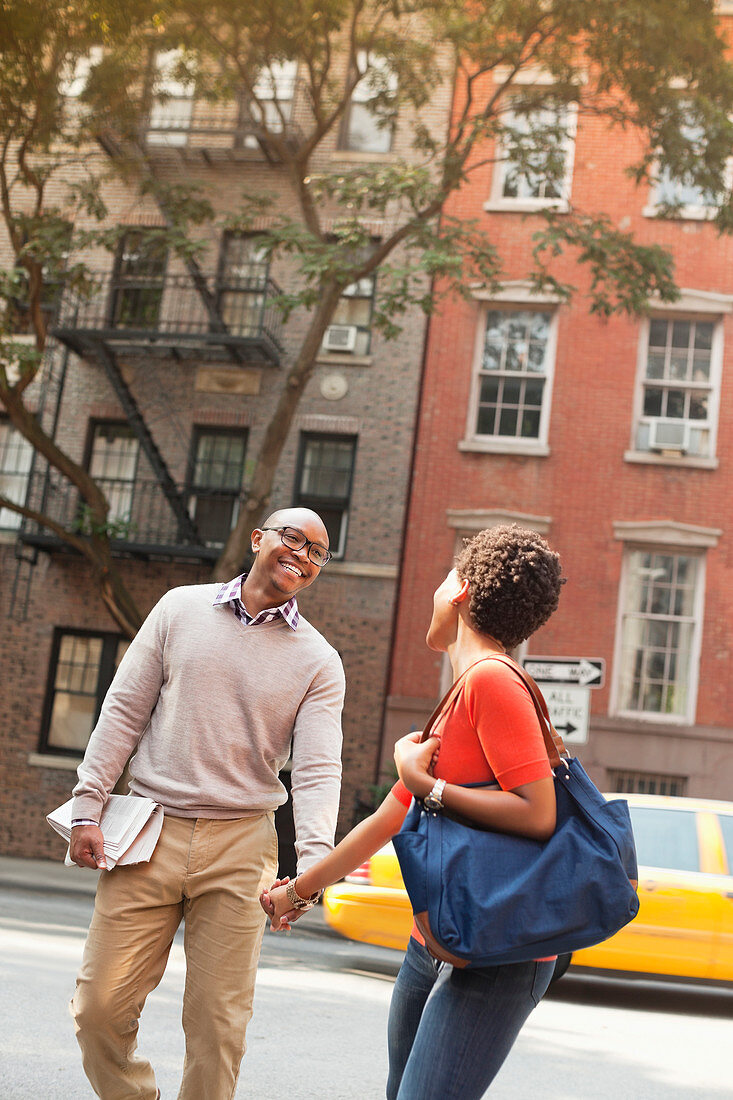 Couple walking together on city street