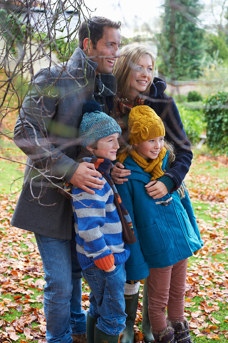 Family smiling together outdoors