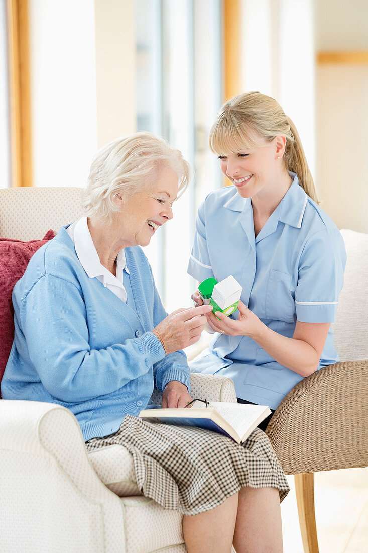 Caregiver talking with older woman