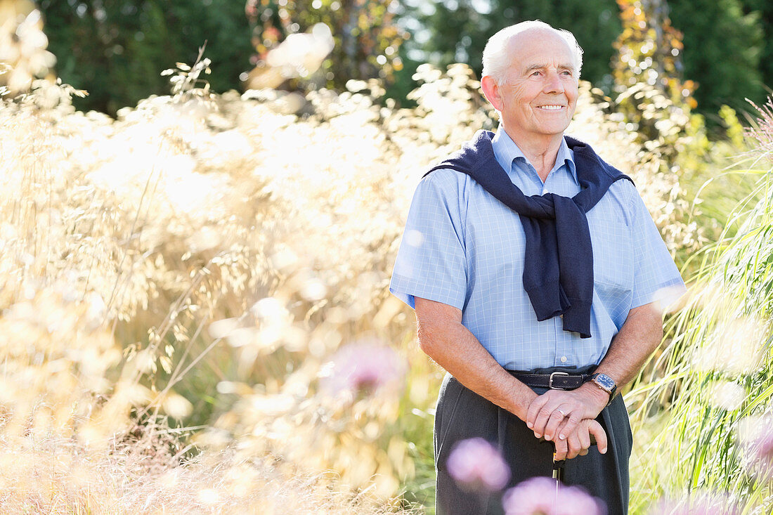 Older man smiling outdoors