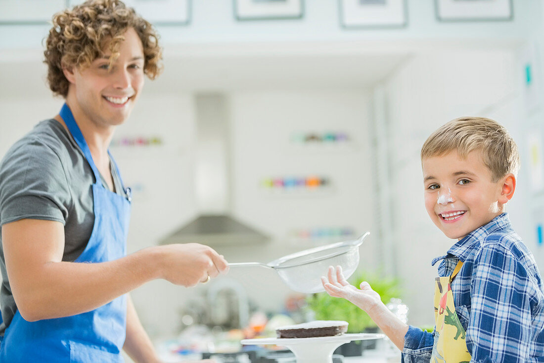 Father and son baking in kitchen