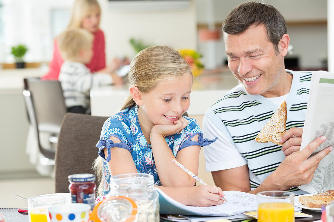 Father and daughter having breakfast