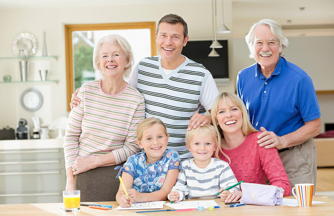 Family smiling together in kitchen