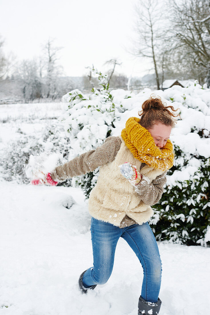 Girl playing in snow