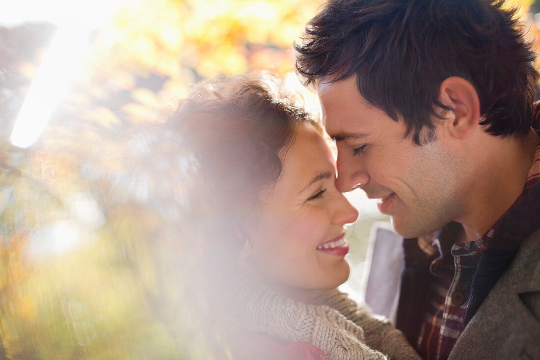 Couple hugging in park