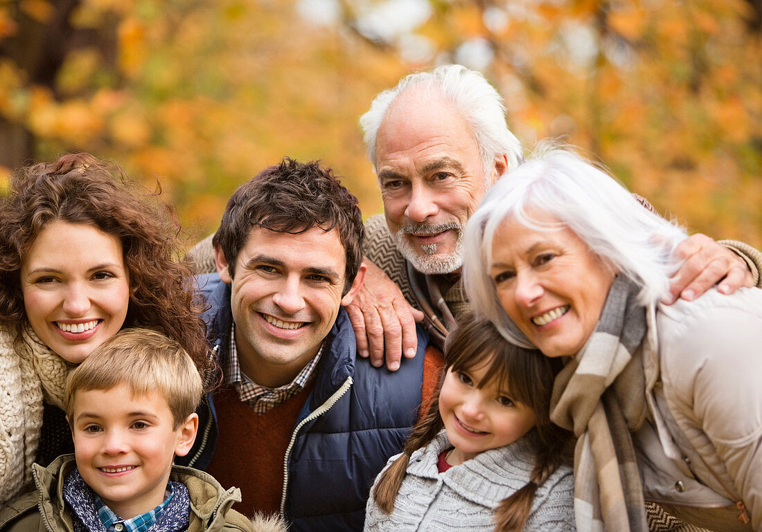 Family smiling together in park