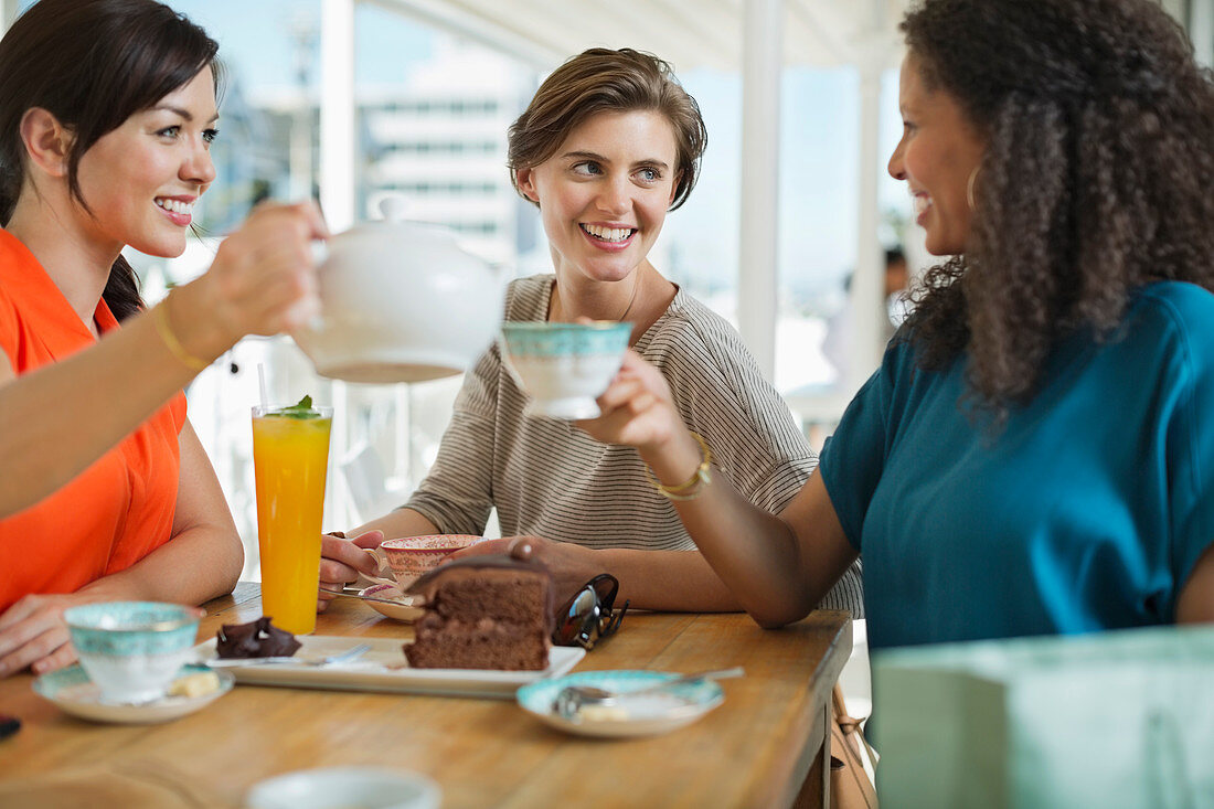Women having coffee and cake together