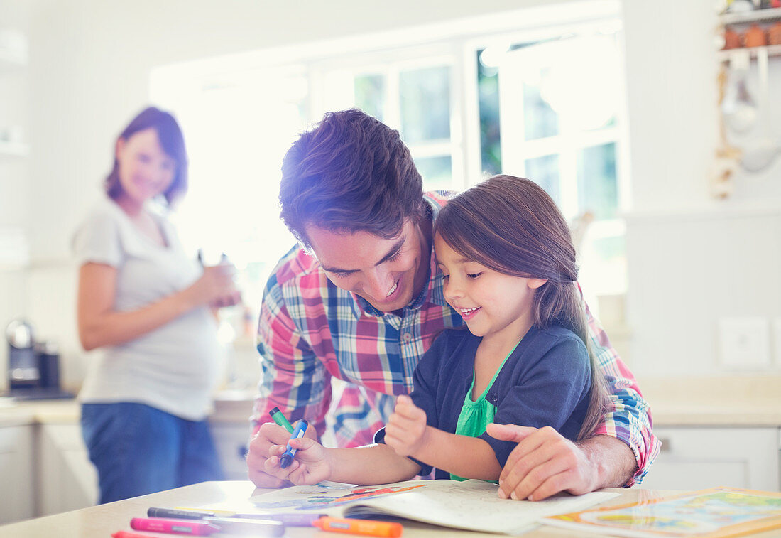 Father helping daughter