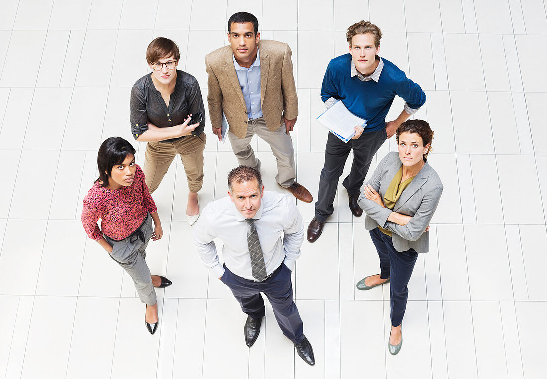 Business people smiling in hallway