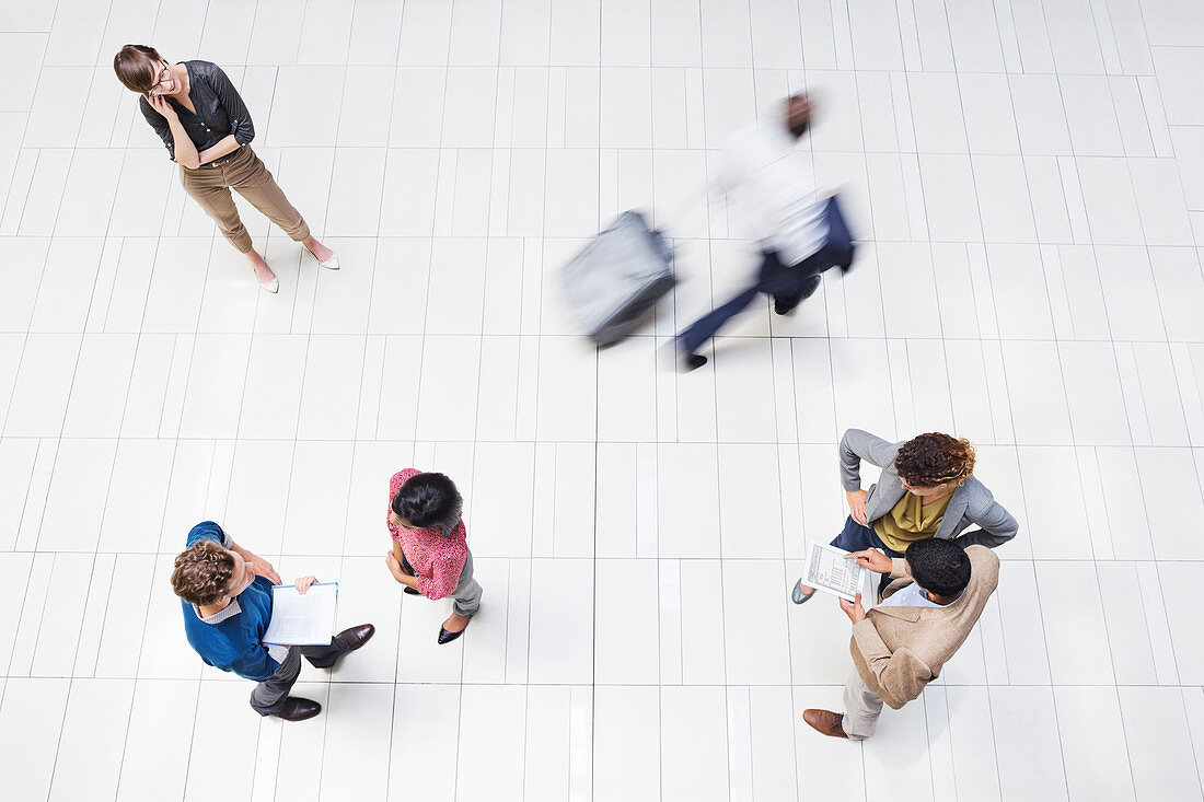 Business people in busy office hallway