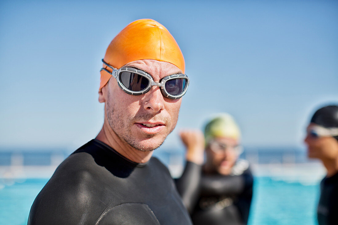 Triathletes in wetsuits with goggles
