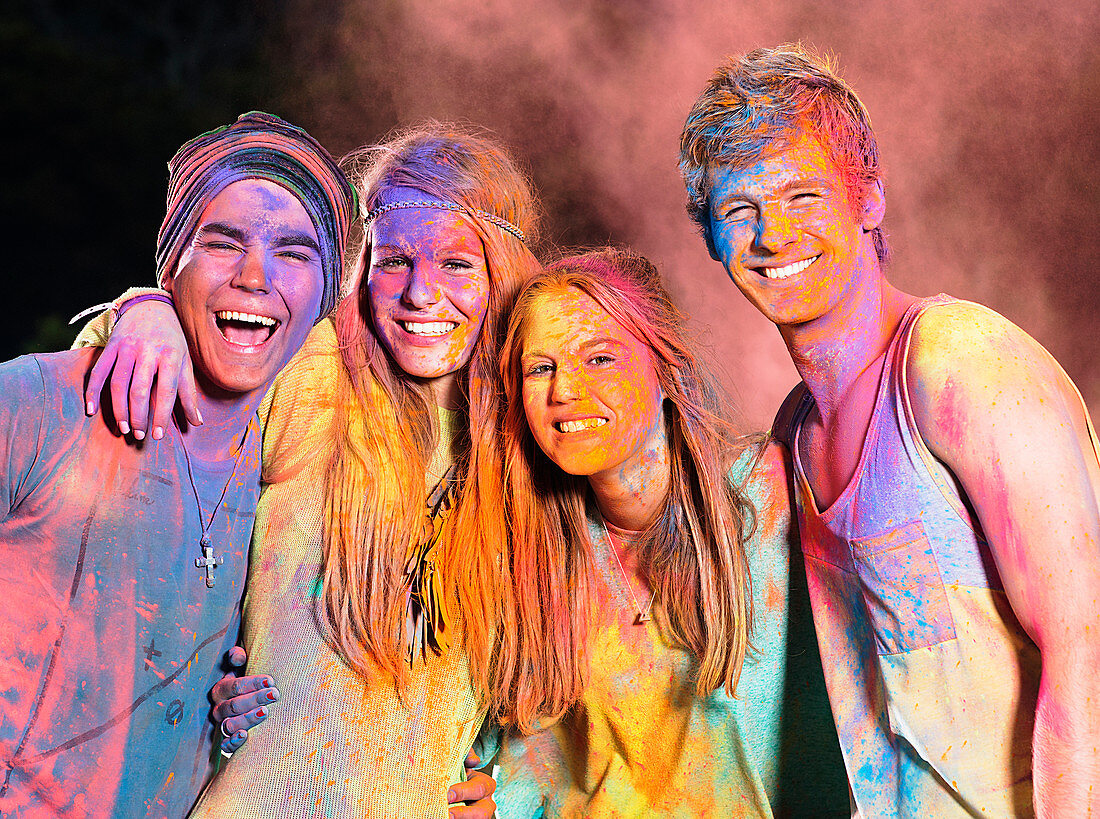 Friends covered in chalk dye