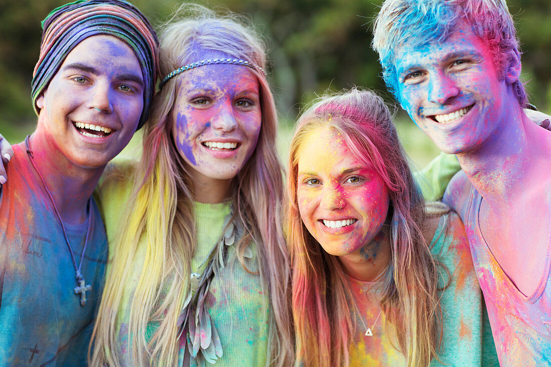 Friends covered in chalk dye