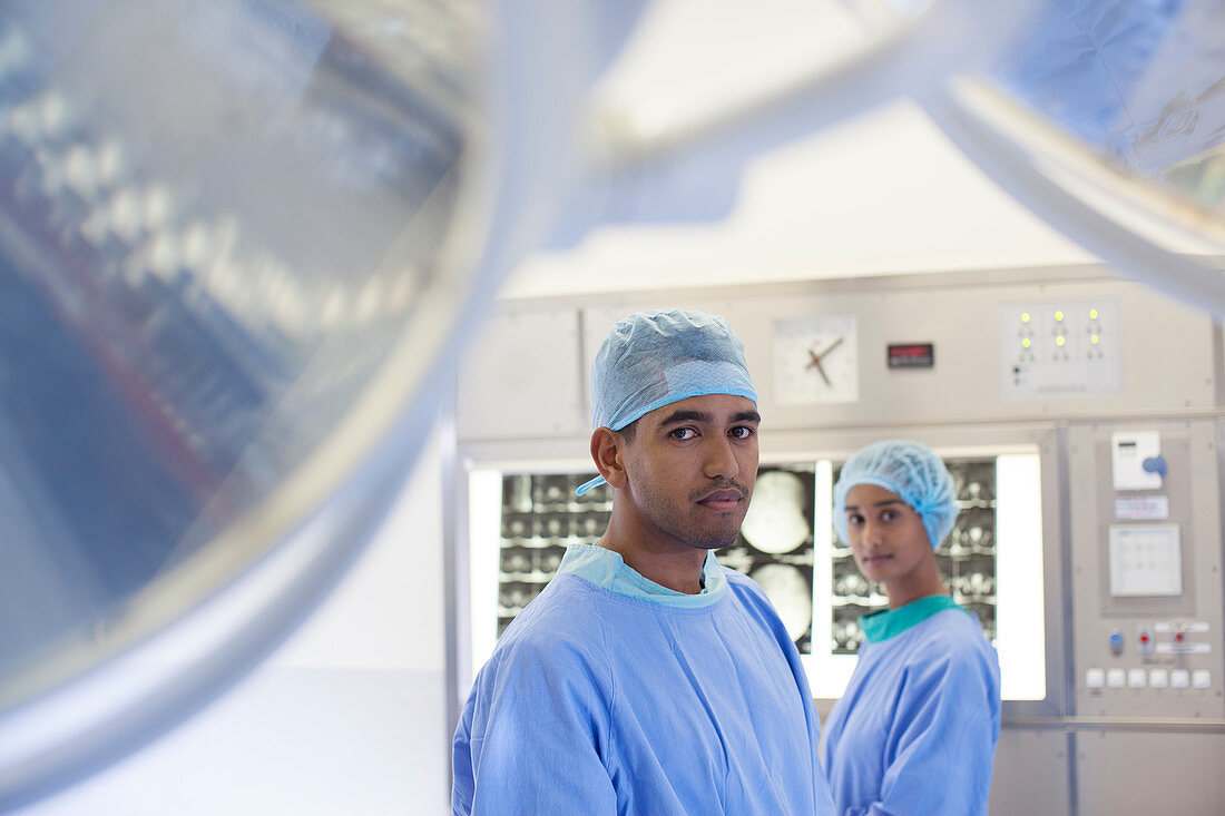 Surgeons standing in operating room