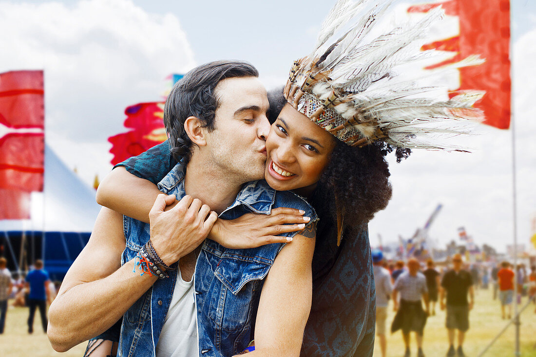 Couple kissing at music festival