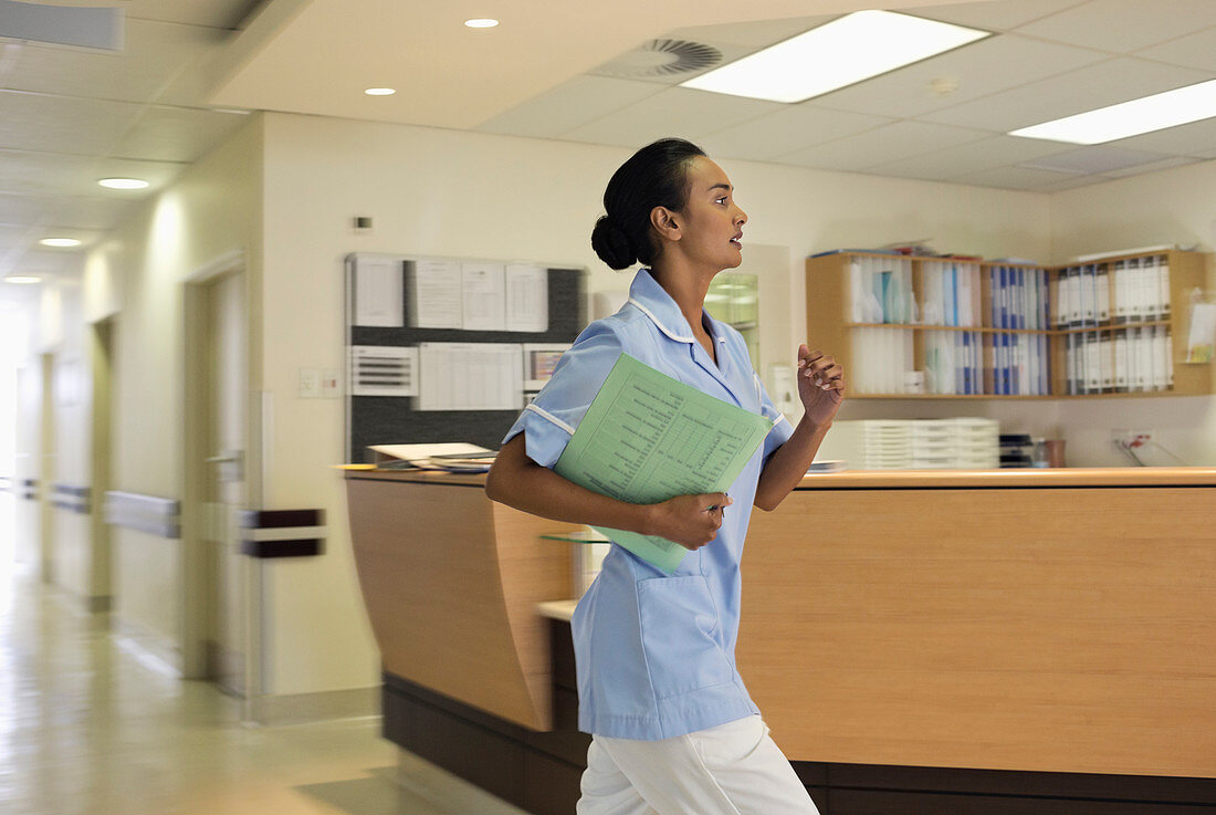 Nurse rushing in hospital hallway