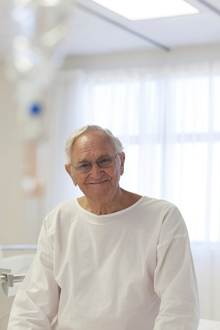 Older patient smiling in hospital room