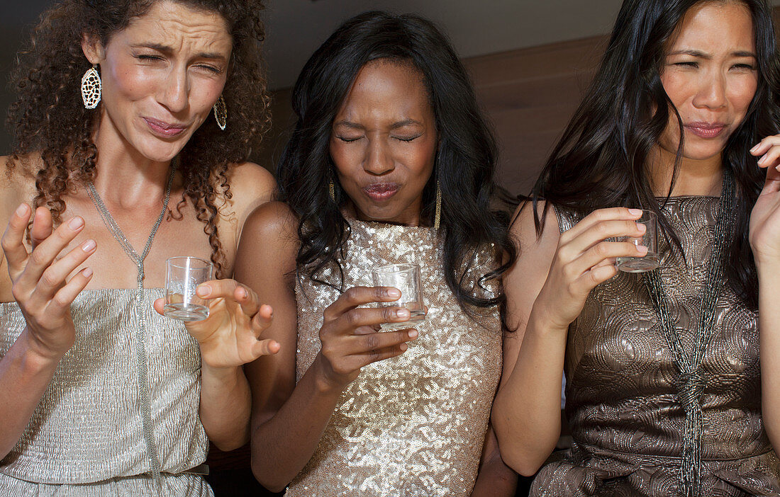 Women having shots drinks at party