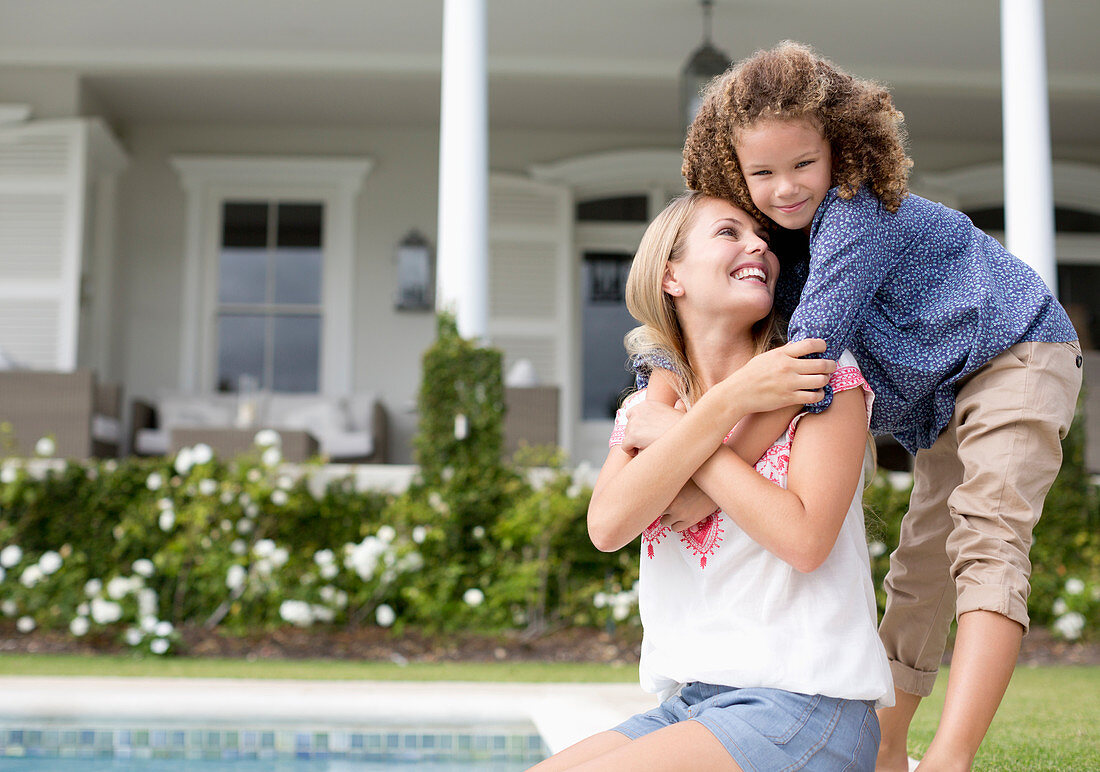 Mother and daughter hugging