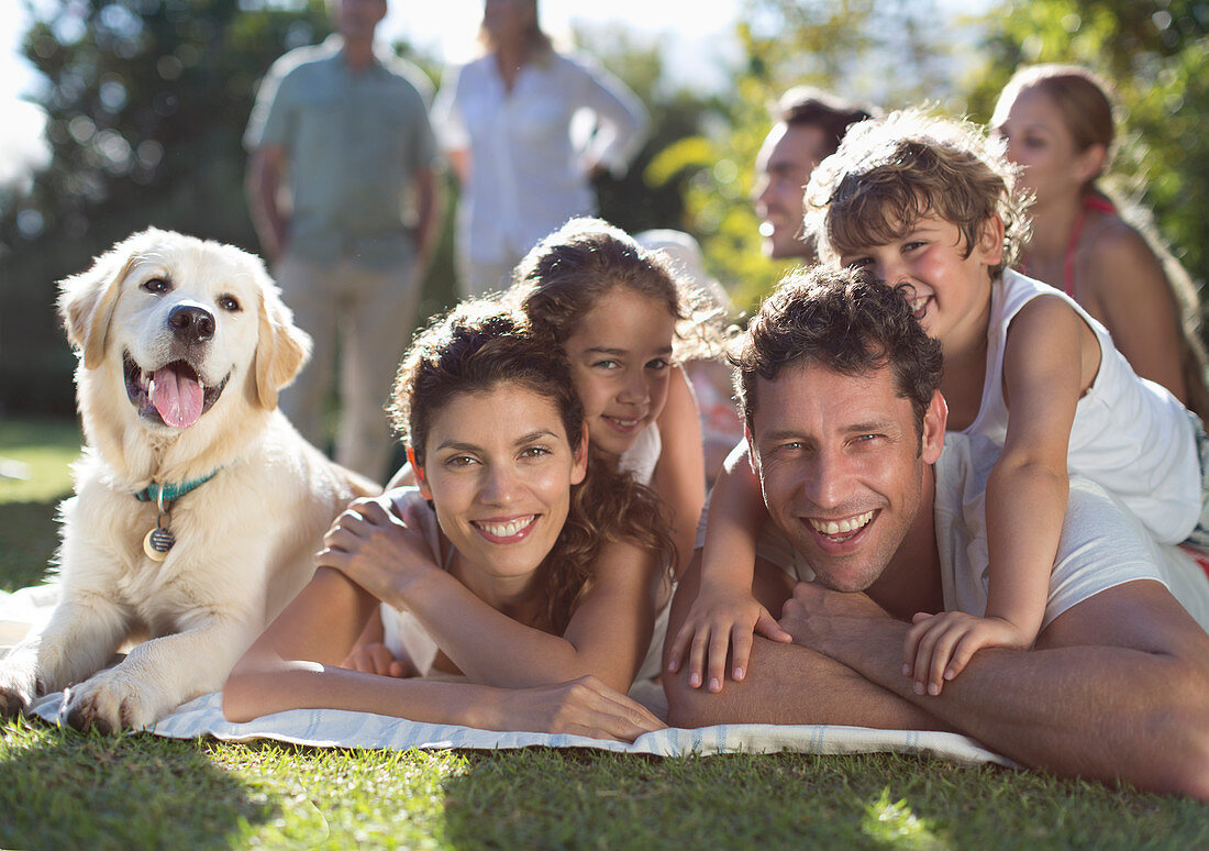 Family relaxing in backyard