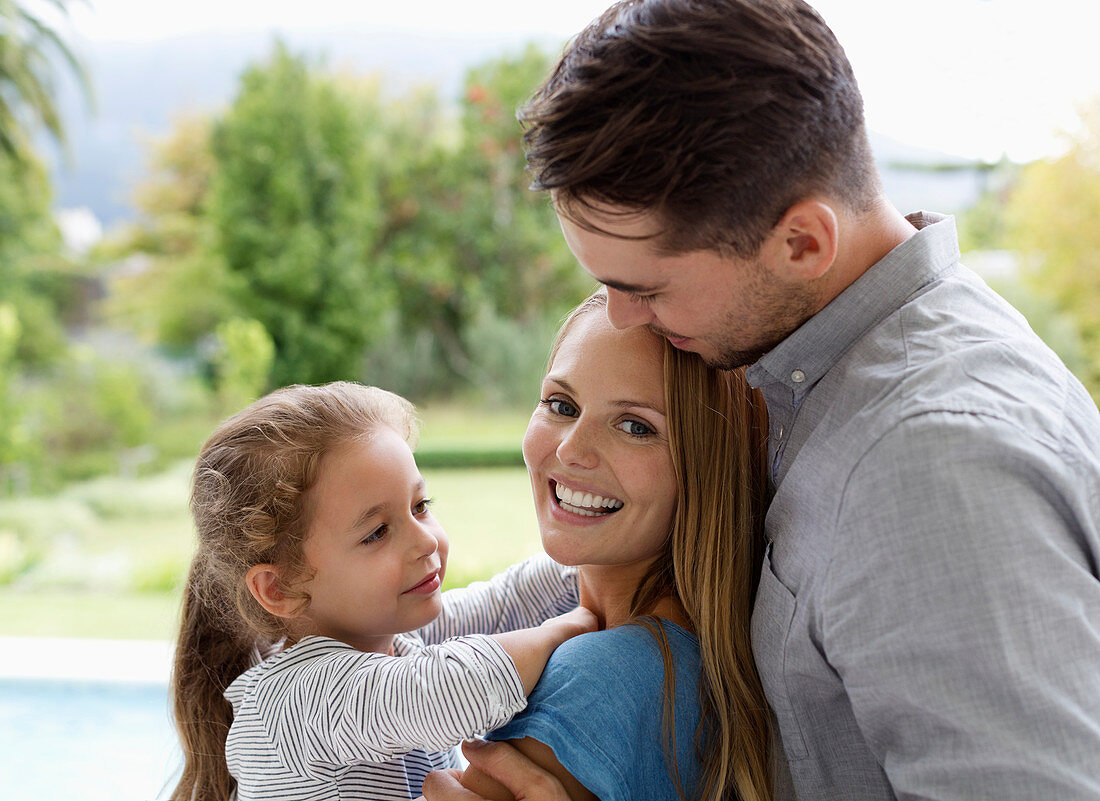 Family smiling together outdoors