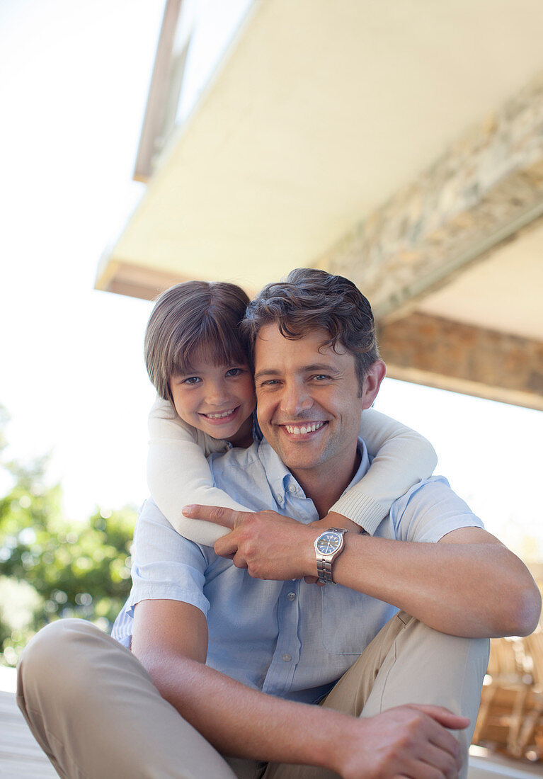 Father and daughter sitting together