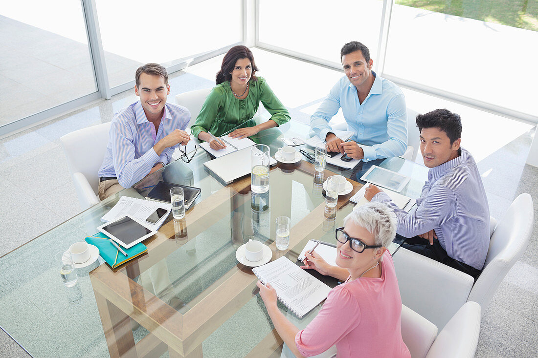 Business people smiling in meeting