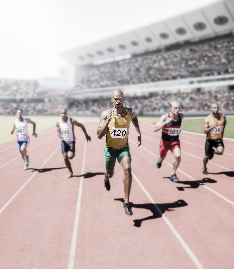 Runners racing on track