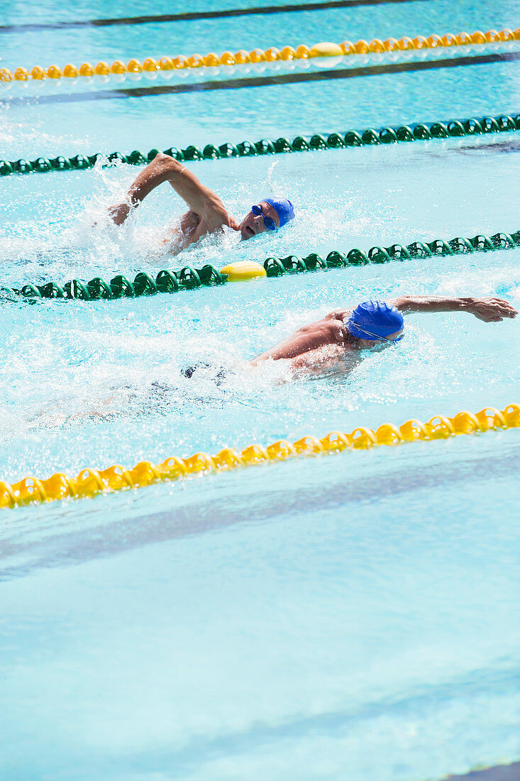 Swimmers racing in pool