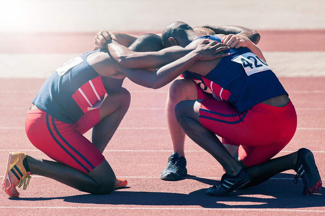 Runners huddled on track