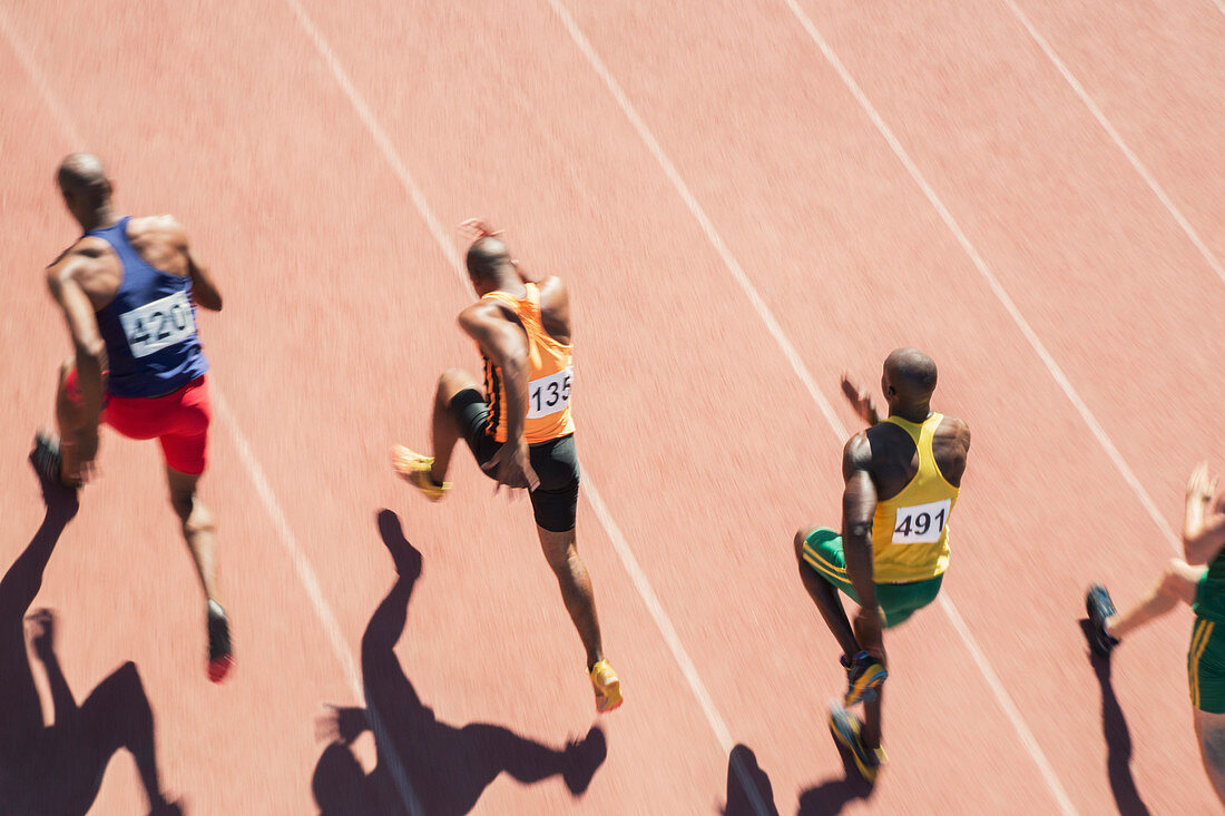 Runners racing on track