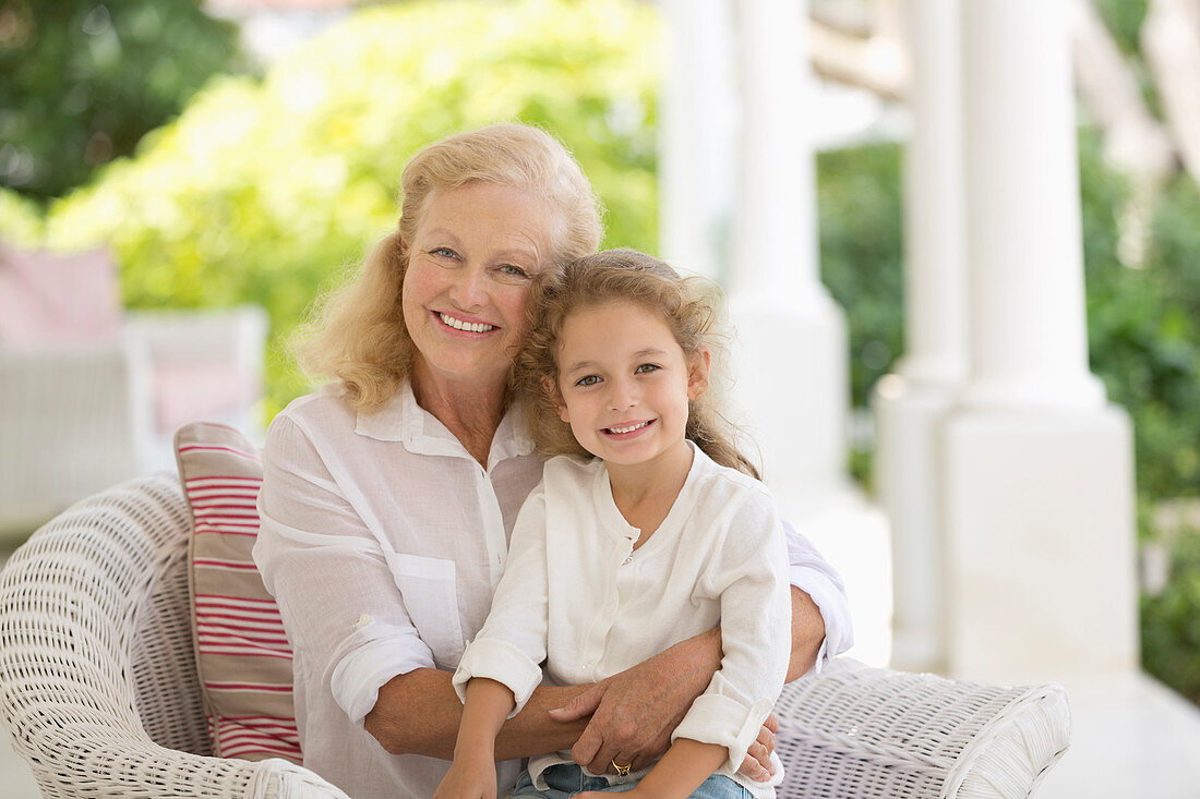 Older woman and granddaughter smiling