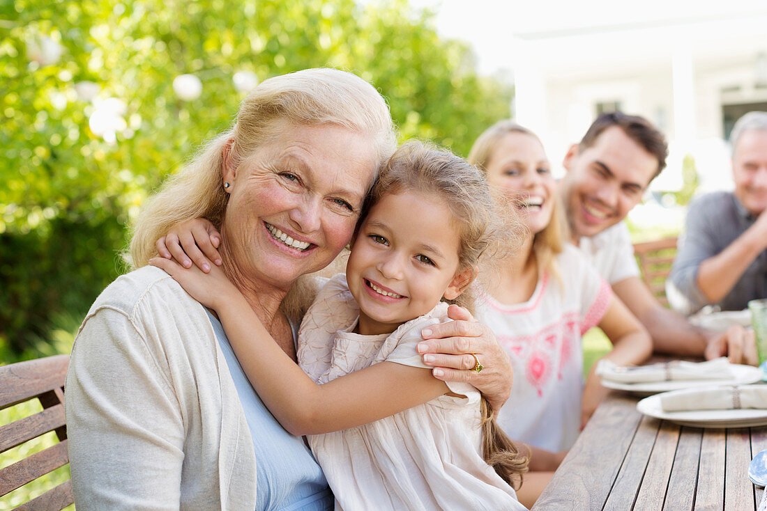 Older woman and granddaughter smiling