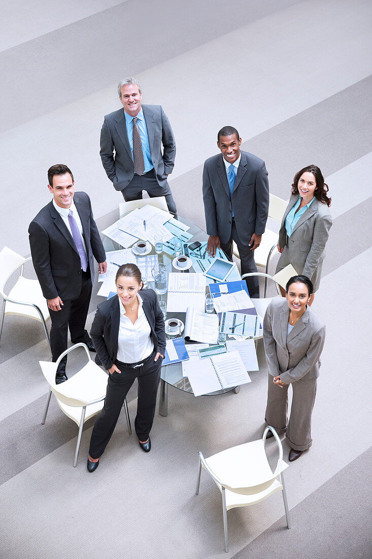 Smiling business people at table