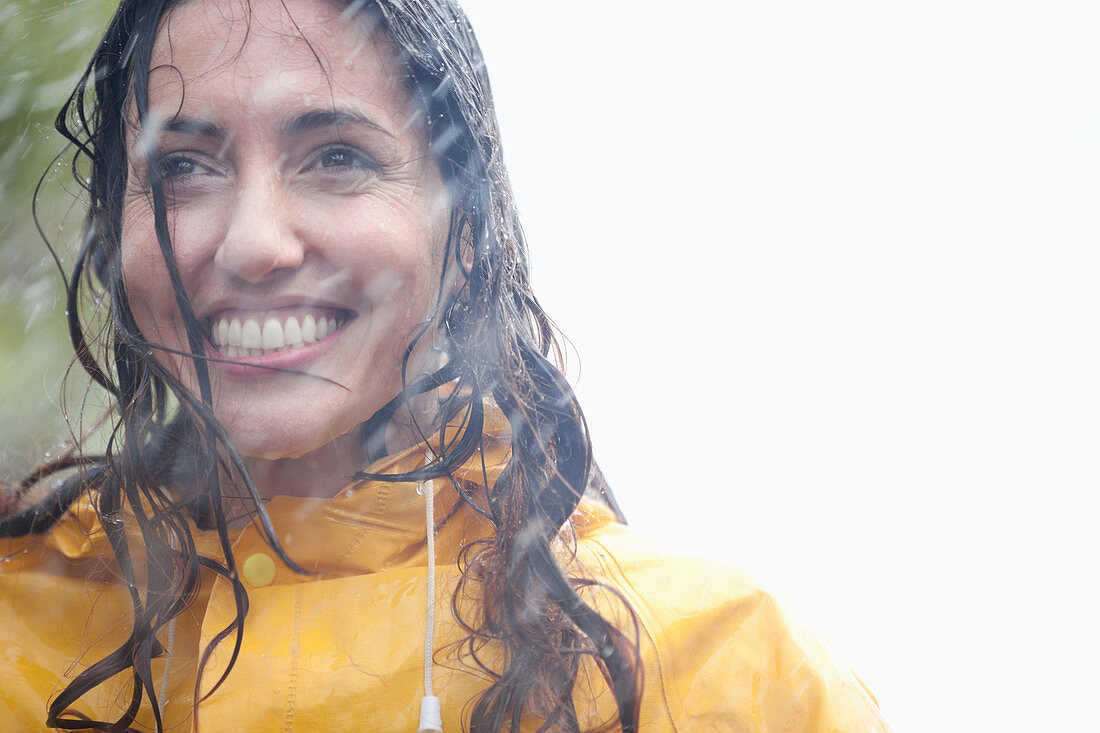 Smiling woman in rain