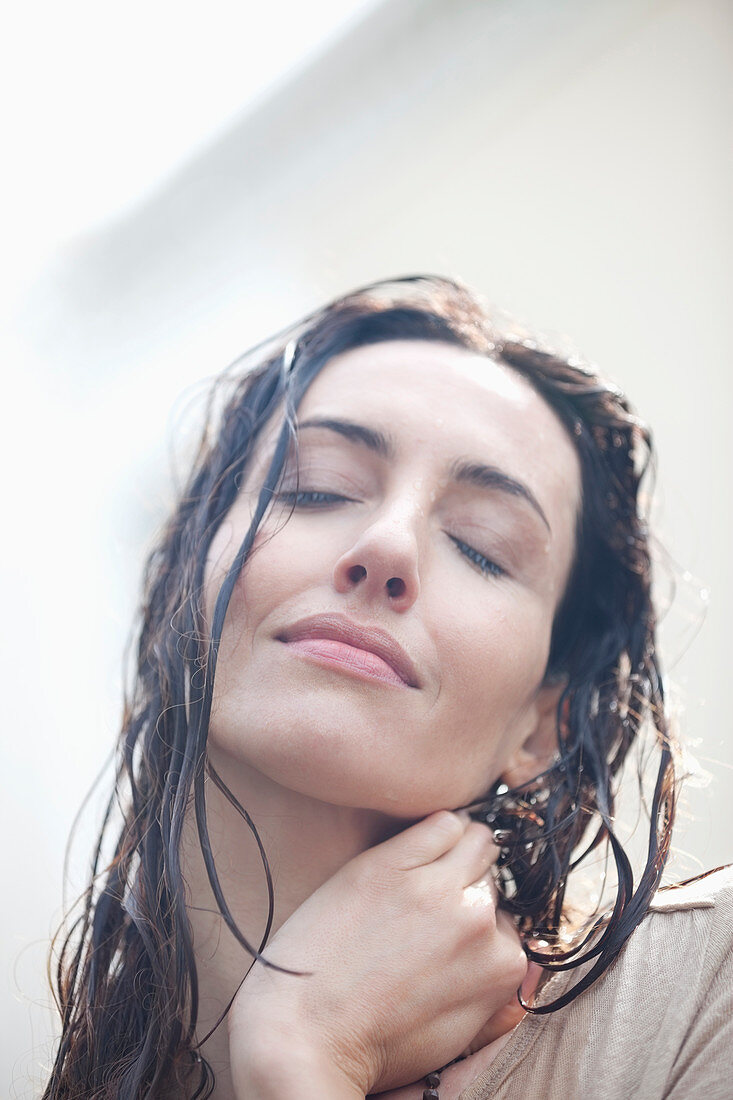 Close up Serene woman with wet hair