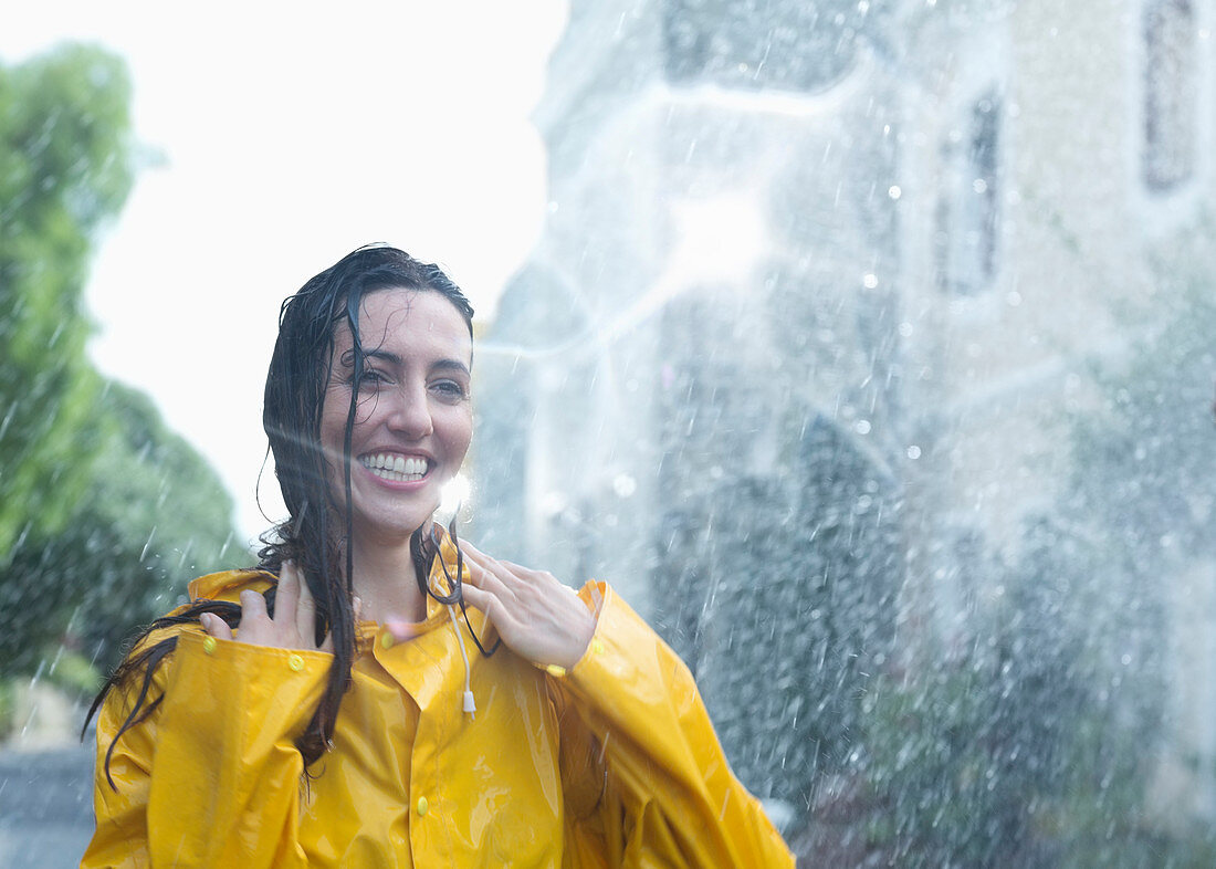 Enthusiastic woman standing in rain
