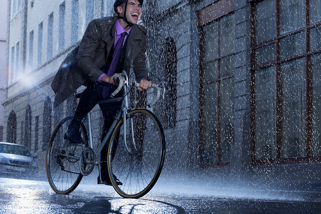 Enthusiastic businessman riding bicycle