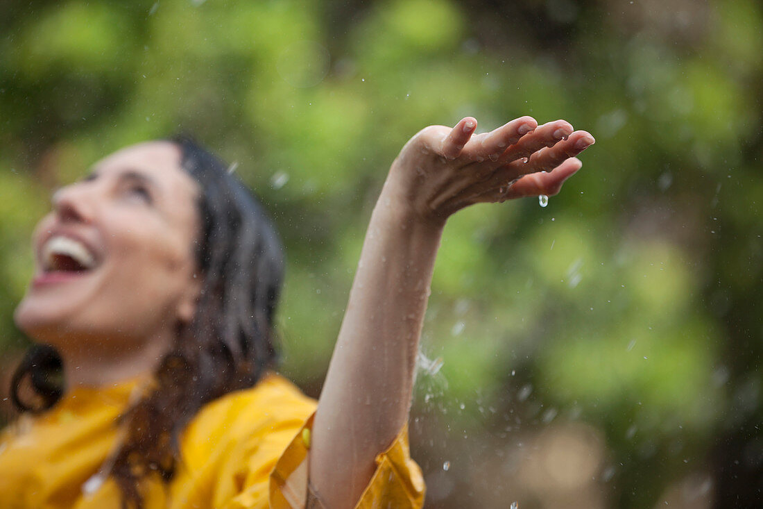 Enthusiastic woman in rain