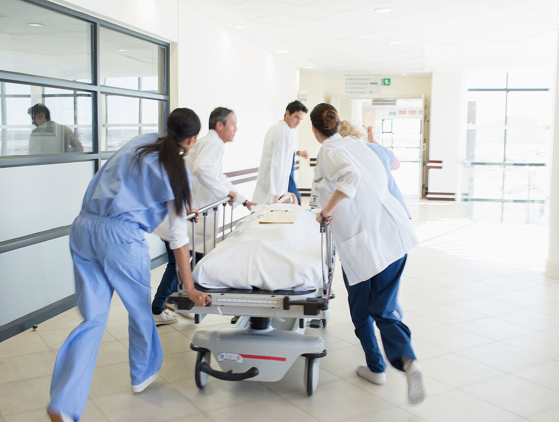 Doctors rushing patient