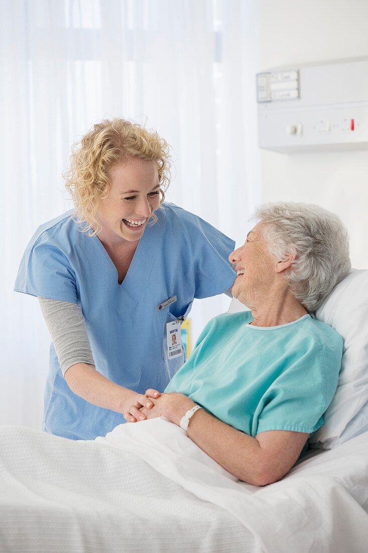 Nurse and senior patient talking room