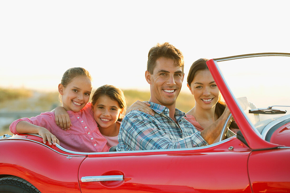 Family in convertible together