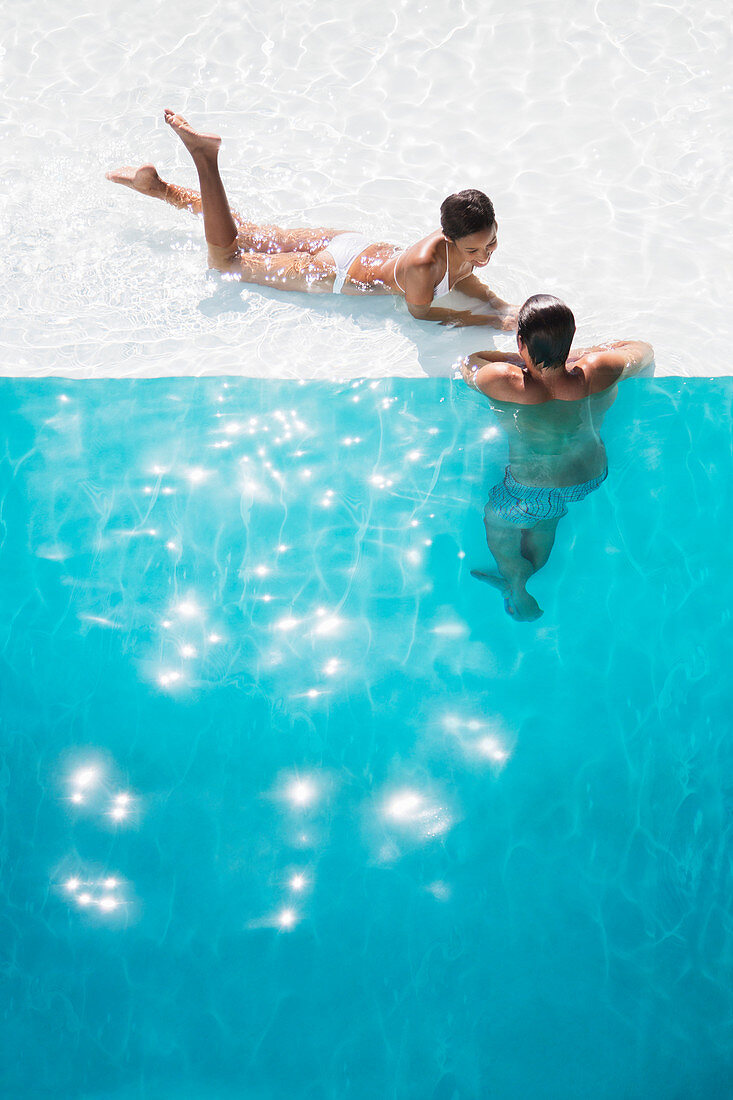 Couple relaxing in swimming pool